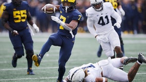 No. 5 Michigan tops No. 10 Penn St 41-17, runs for 418 yards