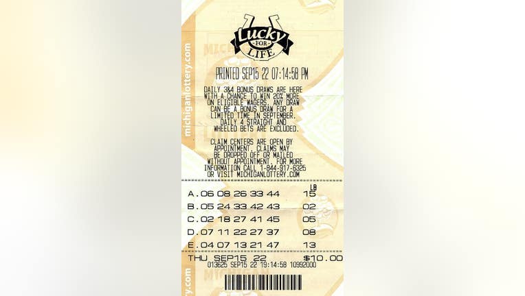 man $25,000 a year for life Michigan Lottery prize using random generator