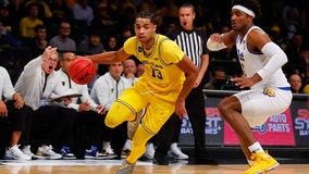 Howard, Dickinson lead No. 20 Michigan to 91-60 rout of Pitt