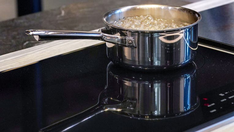 FILE - Water boiling on a cooktop. (Photo by Barry Chin/The Boston Globe via Getty Images)