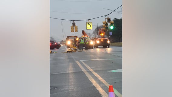15 Mile Road closed near Sterling Heights High School for downed traffic signals, power lines