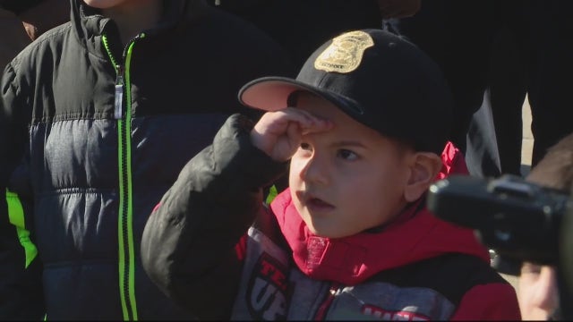 Chief for a day: boy with brain cancer's dream comes true, leads Detroit Police Department