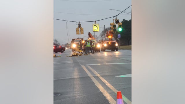15 Mile Road closed near Sterling Heights High School for downed traffic signals, power lines
