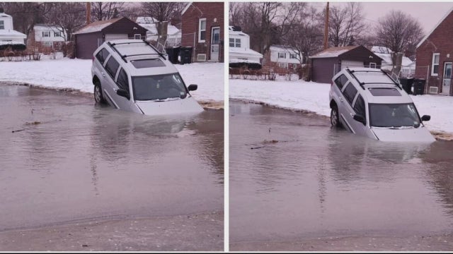 'His car is in a sinkhole': Man pulls self from car stuck in flooded hole in Detroit street