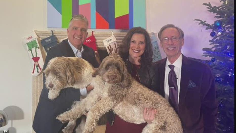 Michigan Gov. Gretchen Whitmer, left, her husband Marc Mallory, the family dogs and Tim Skubick.