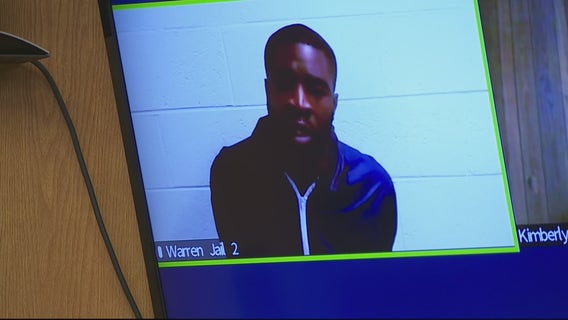 Man accused of shooting at Warren police claims he was giving officer weapon