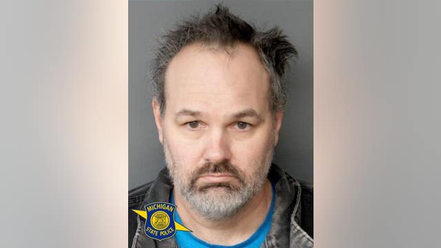 Michigan man accused of threatening utility workers with gun