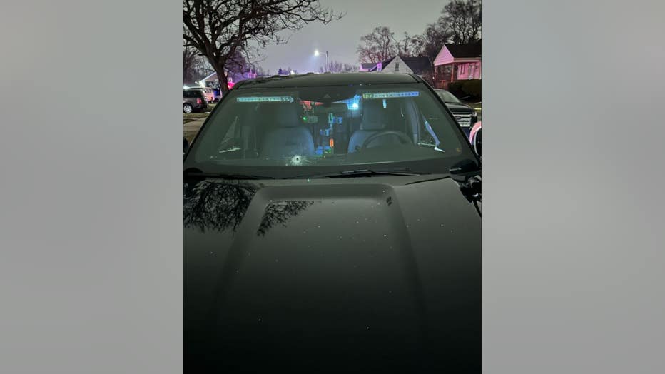 A Detroit police cruiser with bullet holes visible from Friday night.
