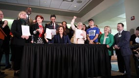 Whitmer signs safe storage and background check gun bills into law