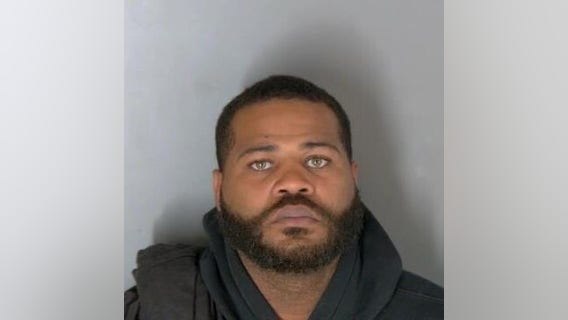 Man robbed at gunpoint while sitting in vehicle in front of his Warren home; suspect charged