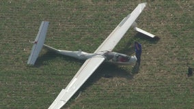 Pilot, passenger injured when glider crashes during emergency landing in Livingston County