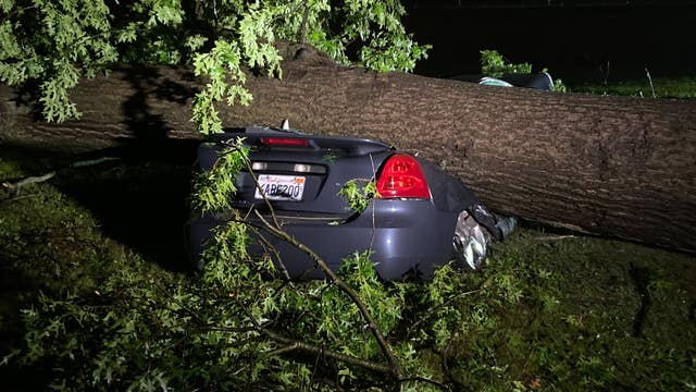 Severe weather brings power outages, flattened cars, and damaged homes with more rain on the way