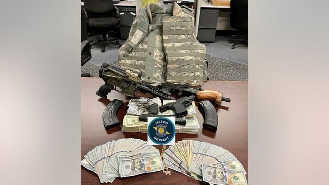 Driver caught with drugs also had body armor, guns, and stacks of cash