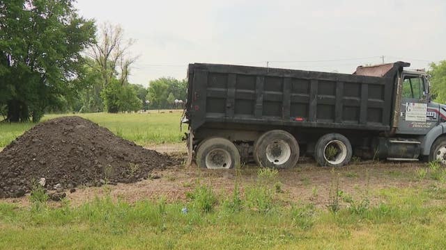 Truck allegedly caught dumping dirt in Detroit, gets stuck in the mud - and ticketed