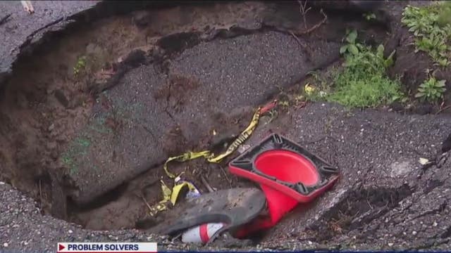 Massive driveway sinkhole traps elderly Detroit woman in home