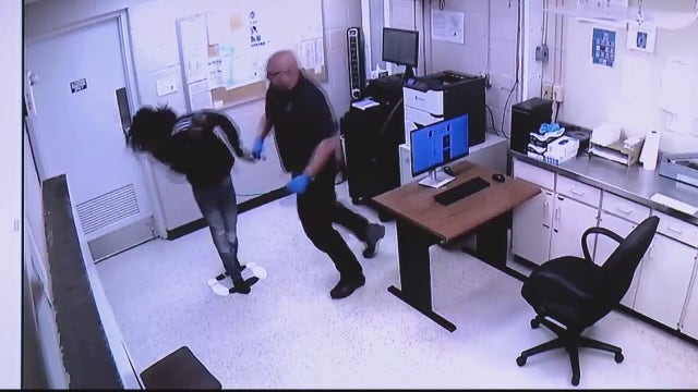 Warren officer seen hitting suspect previously accused of assaulting other suspects