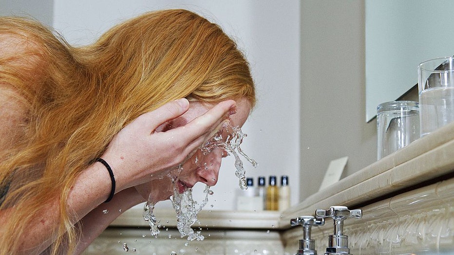 Woman-washing-her-face.jpg