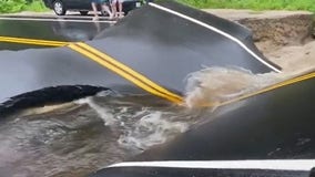 Watch: New Hampshire road buckles during flash flood
