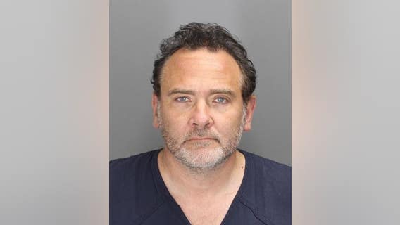 Ford executive accused of threatening wife with butane torch during assault