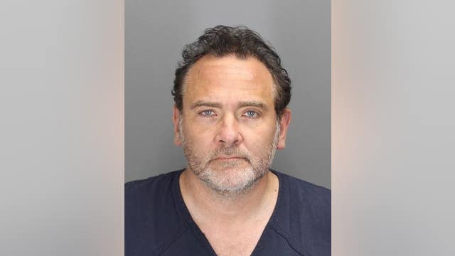 Ford executive accused of threatening wife with butane torch during assault