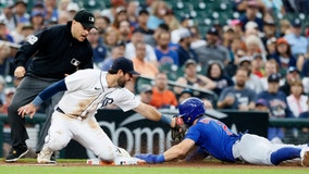 Yan Gomes’ single breaks an 8th-inning tie as the wild card-contending Cubs beat the Tigers 6-4