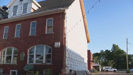Battle of inches stops rebuilding of historic Holly Hotel 1 year after fire