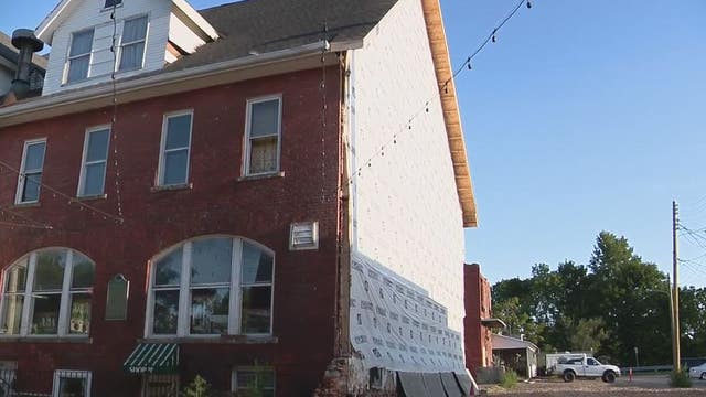 Battle of inches stops rebuilding of historic Holly Hotel 1 year after fire