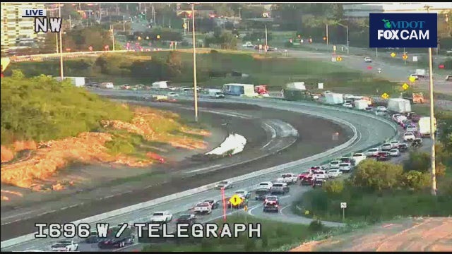 696 backup in Oakland County due to construction zone crash