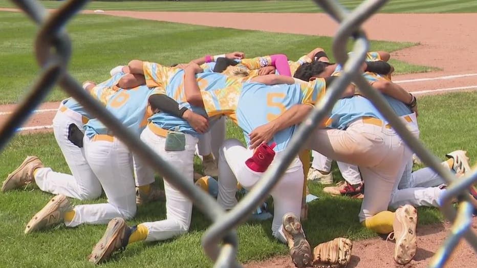 The baseball team from Hawaii takes a moment of silence.