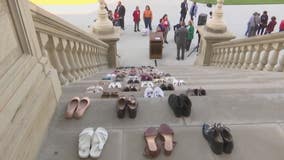 Protest with 70 pairs of shoes at State Capitol represent domestic violence victims killed by guns