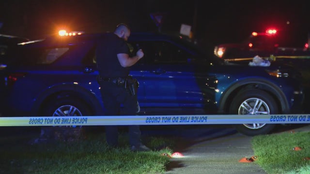 3 shot on porch of Detroit home