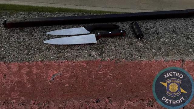 Man caught riding bicycle on I-696 while armed with metal rod, butcher knives