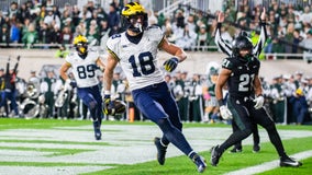 McCarthy throws 3 TD passes in 1st half, No. 2 Michigan routs Michigan State 49-0