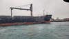 Freighter carrying 21,000 tons of wheat runs aground on Detroit River