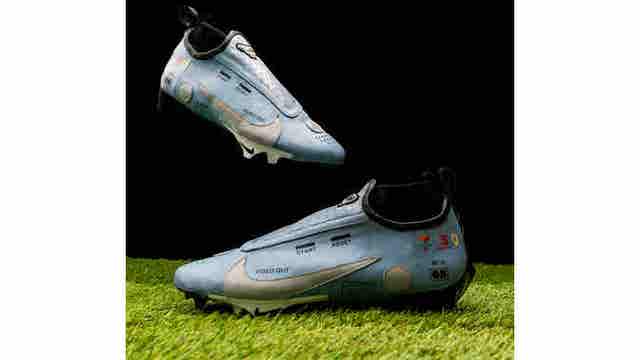 Blake Corum selling custom cleats at charity auction