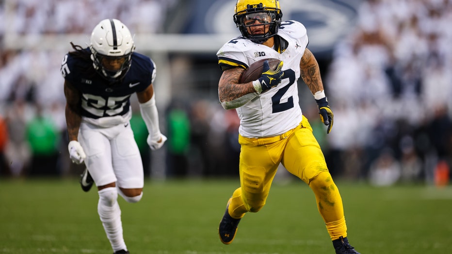 Without Jim Harbaugh No. 2 Michigan grinds past No. 9 Penn State