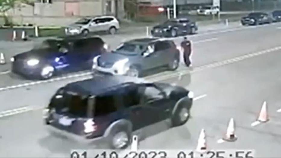The suspect vehicle was a blue Ford Explorer, seen driving away from the camera.