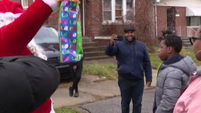 Santa and Filthy Cares nonprofit surprise families with gifts on Christmas morning