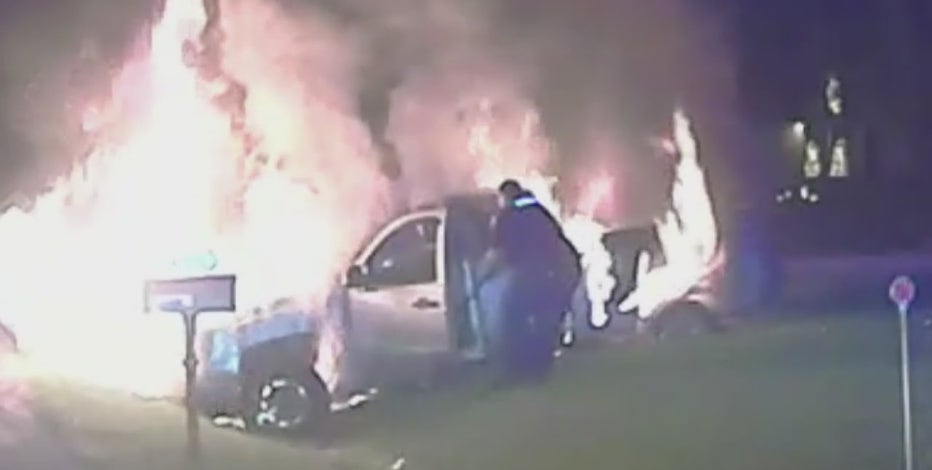 Fraser officer pulls woman from burning pickup truck