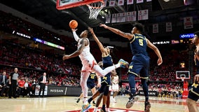 Donta Scott scores 20 of his 22 in the second half as Maryland gets past short-handed Michigan 64-57