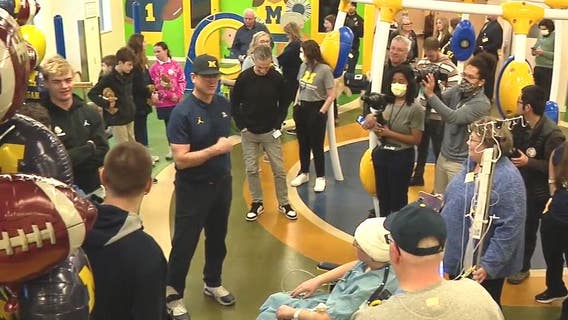 U-M Coach Harbaugh, players visit CS Mott's Children's Hospital