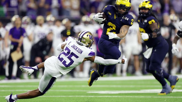 Michigan overwhelms Washington 34-13 for 1st national championship since 1997