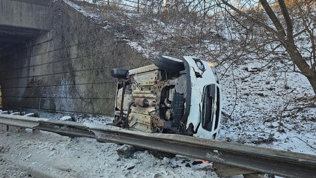 Car flips after driver loses control on icy Melvindale road