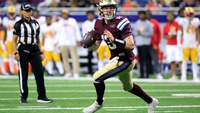 DETROIT, MICHIGAN - JUNE 18: E.J. Perry #13 of the Michigan Panthers looks to pass against the Philadelphia Stars during the fourth quarter of the game at Ford Field on June 18, 2023 in Detroit, Michigan. (Photo by Justin Casterline/USFL/Getty Images)