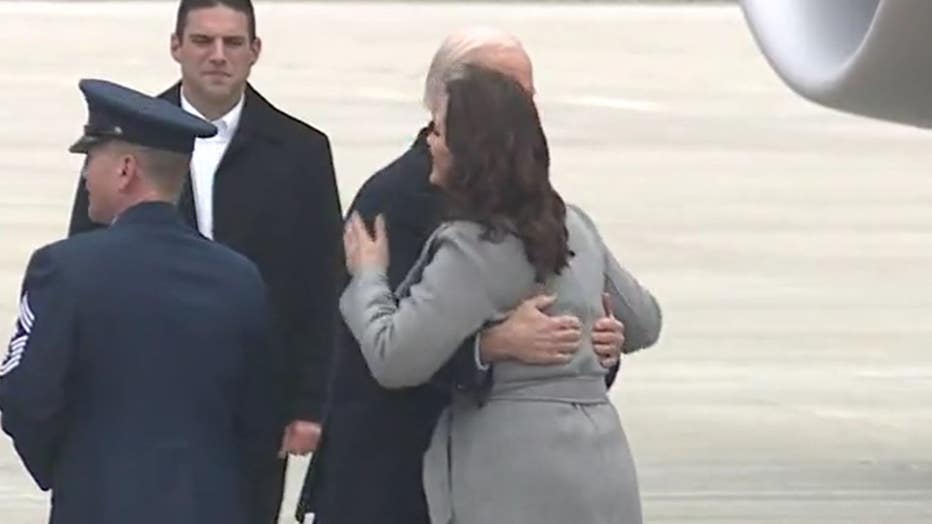 President Joe Biden greets Gov. Gretchen Whitmer after arriving.