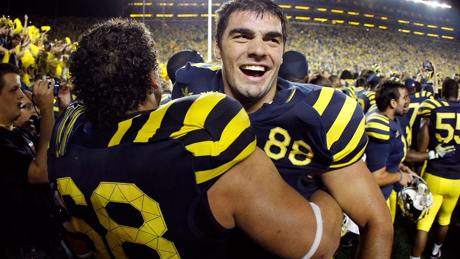 ANN ARBOR, MI - SEPTEMBER 10: Craig Roh #88 of the Michigan Wolverines celebrates a 35-31 over Notre Dame Fighting Irish with Mike Martin #68 at Michigan Stadium on September 10, 2010 in Ann Arbor, Michigan. (Photo by Gregory Shamus/Getty Images)