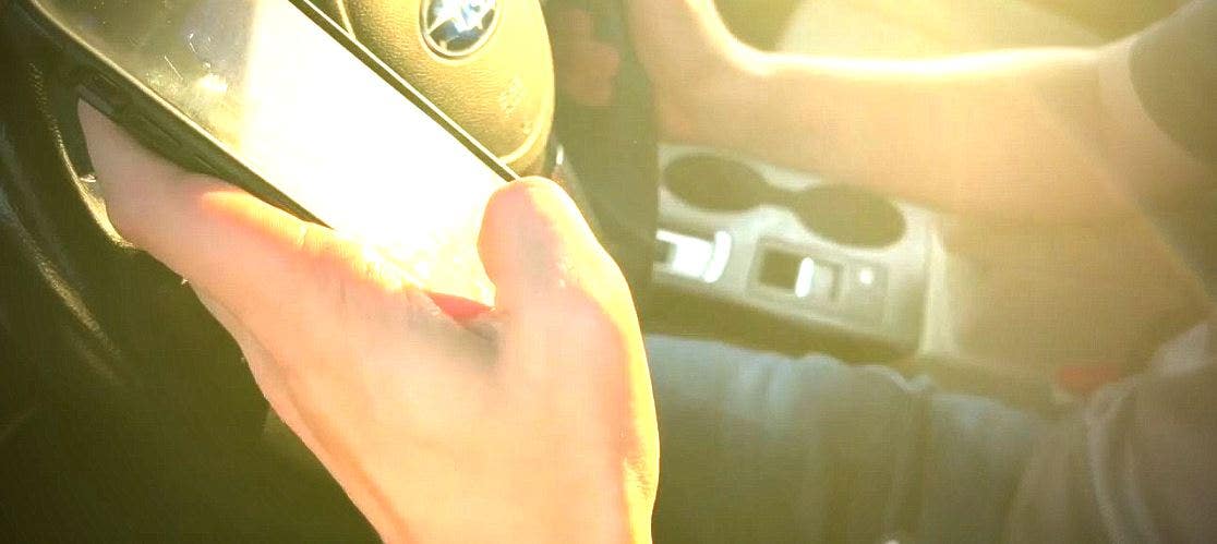 Texting driver runs red light, hits MSP trooper in Downtown Detroit