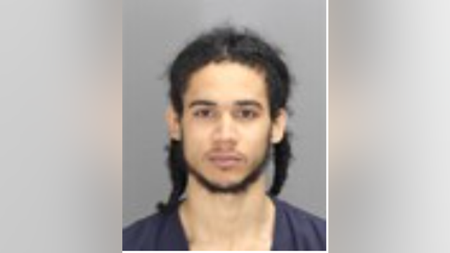 Man brandishes gun at high school students, flees with adult son