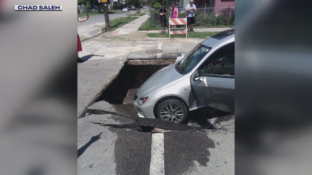 Woman drives into large sinkhole in southwest Detroit, repairs underway