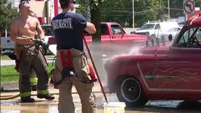 Dearborn Heights Firefighters wash cars to fund childhood burn victim camp